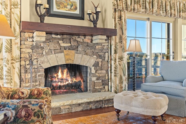 living area with hardwood / wood-style floors and a fireplace