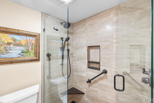 bathroom featuring toilet and walk in shower