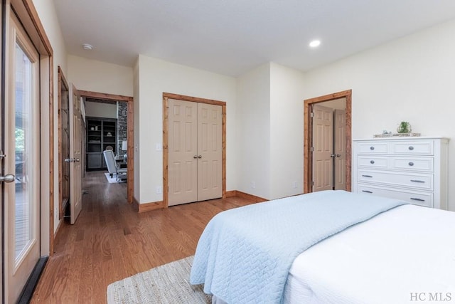 bedroom featuring light hardwood / wood-style floors and a closet