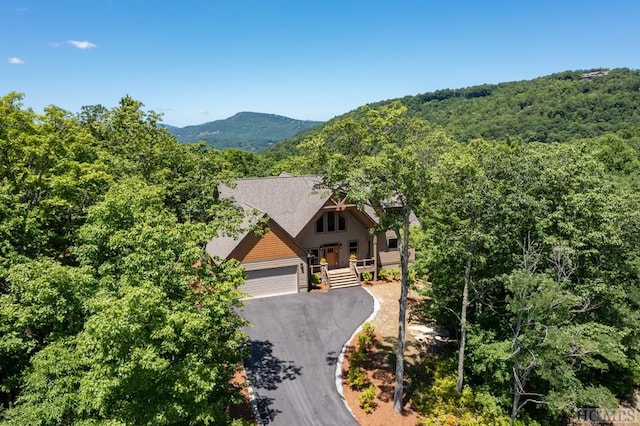 view of front of property featuring a mountain view and a garage