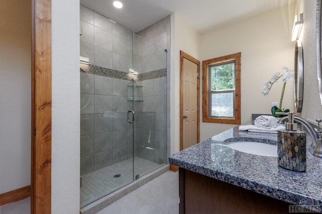 bathroom with vanity and walk in shower