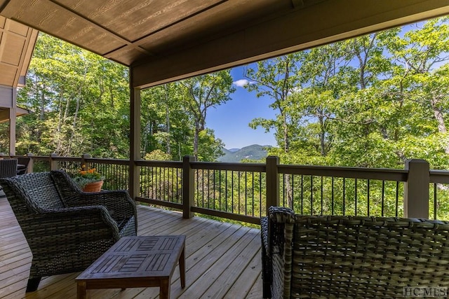 wooden terrace with a mountain view