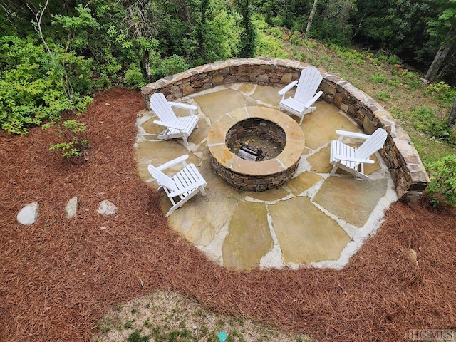 view of patio / terrace featuring an outdoor fire pit