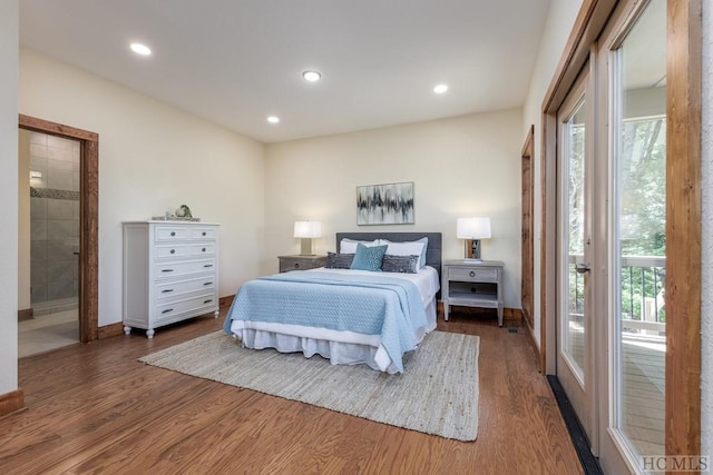 bedroom featuring dark wood-type flooring and connected bathroom