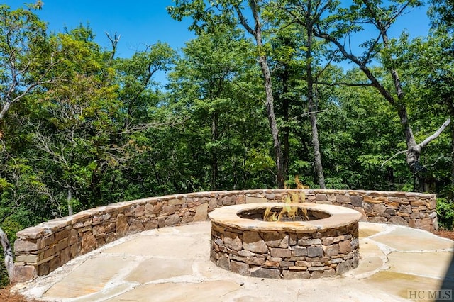 view of patio / terrace with a fire pit