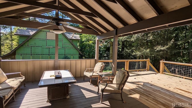 wooden deck with a gazebo, outdoor lounge area, and ceiling fan