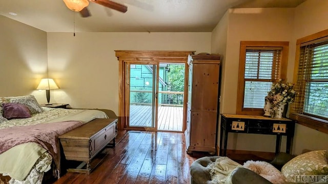 bedroom with dark hardwood / wood-style floors, ceiling fan, and access to exterior