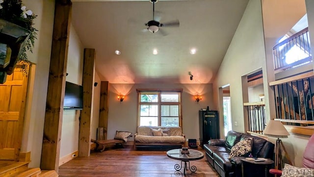 living room featuring hardwood / wood-style floors and high vaulted ceiling