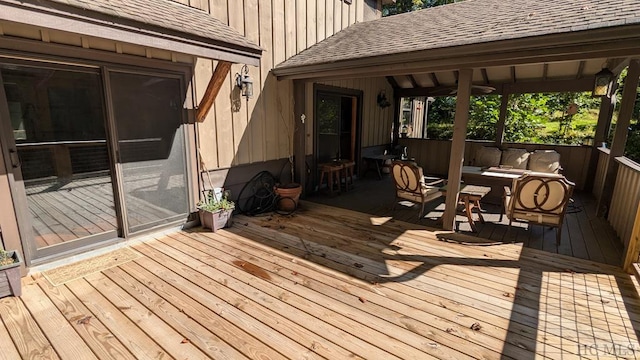 wooden deck featuring an outdoor hangout area