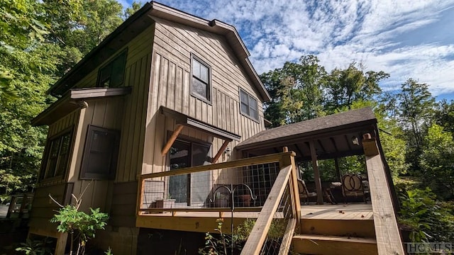 view of side of property featuring a deck