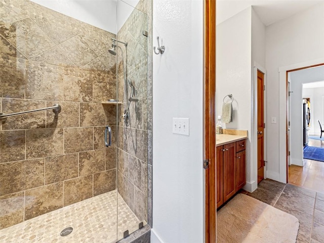 130 Cross Vine Dr, Tuckasegee, NC 28783 - full bathroom with a stall shower, vanity, and baseboards