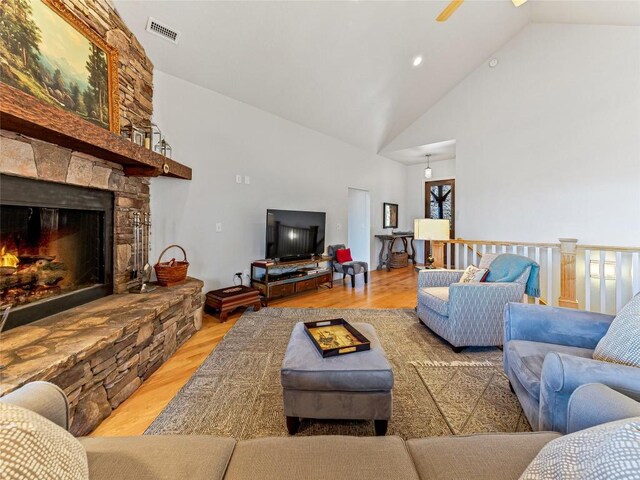 130 Cross Vine Dr, Tuckasegee, NC 28783 - living room with high vaulted ceiling, visible vents, a fireplace, and wood finished floors