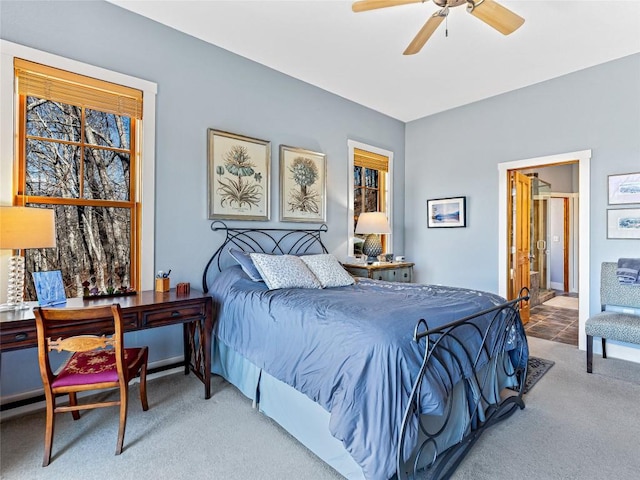 130 Cross Vine Dr, Tuckasegee, NC 28783 - bedroom featuring a ceiling fan, connected bathroom, and light colored carpet
