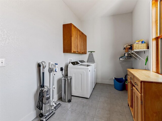 130 Cross Vine Dr, Tuckasegee, NC 28783 - laundry room with light tile patterned floors, washer and clothes dryer, cabinet space, and baseboards