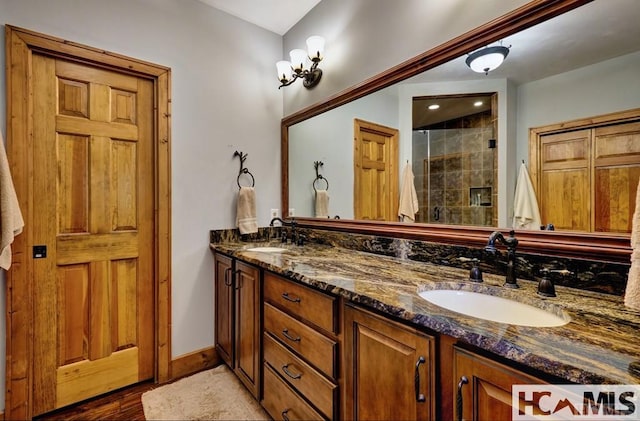 129 Cedar Creek Rd, Glenville, NC 28736 - full bathroom with double vanity, a stall shower, and wood finished floors