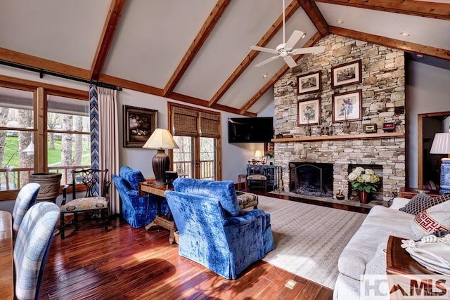 129 Cedar Creek Rd, Glenville, NC 28736 - living area with wood finished floors, healthy amount of natural light, a ceiling fan, beamed ceiling, and high vaulted ceiling