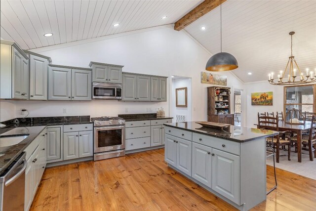 1034 E Rochester Dr, Cashiers, NC 28717 - kitchen with appliances with stainless steel finishes, gray cabinetry, light wood-style floors, beam ceiling, and high vaulted ceiling