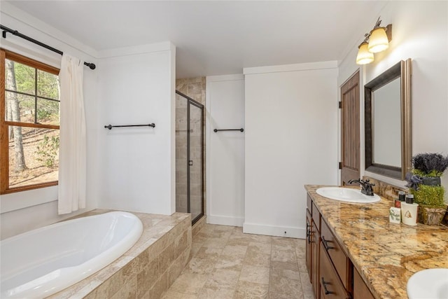 1034 E Rochester Dr, Cashiers, NC 28717 - full bathroom featuring a stall shower, a garden tub, double vanity, and baseboards