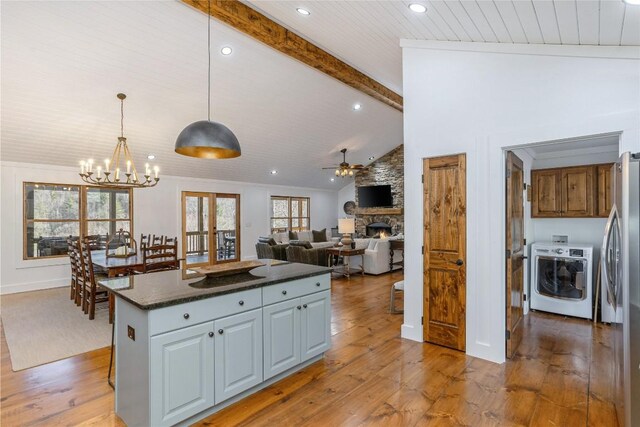 1034 E Rochester Dr, Cashiers, NC 28717 - kitchen with light wood finished floors, freestanding refrigerator, a chandelier, and recessed lighting