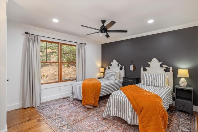 1034 E Rochester Dr, Cashiers, NC 28717 - bedroom with wood finished floors, baseboards, recessed lighting, a ceiling fan, and crown molding