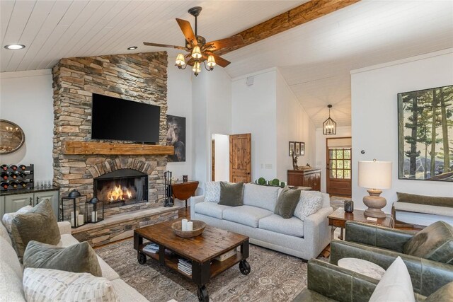 1034 E Rochester Dr, Cashiers, NC 28717 - living room with lofted ceiling, a ceiling fan, and a stone fireplace