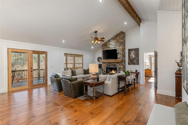 1034 E Rochester Dr, Cashiers, NC 28717 - living room with a ceiling fan, a stone fireplace, beam ceiling, french doors, and hardwood / wood-style flooring