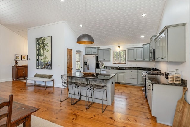 1034 E Rochester Dr, Cashiers, NC 28717 - kitchen with gray cabinets, stainless steel appliances, a kitchen breakfast bar, a center island, and recessed lighting