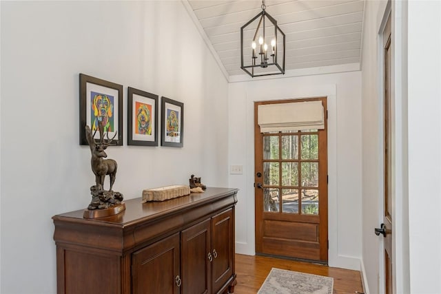 1034 E Rochester Dr, Cashiers, NC 28717 - doorway with a chandelier, light wood-type flooring, and wooden ceiling