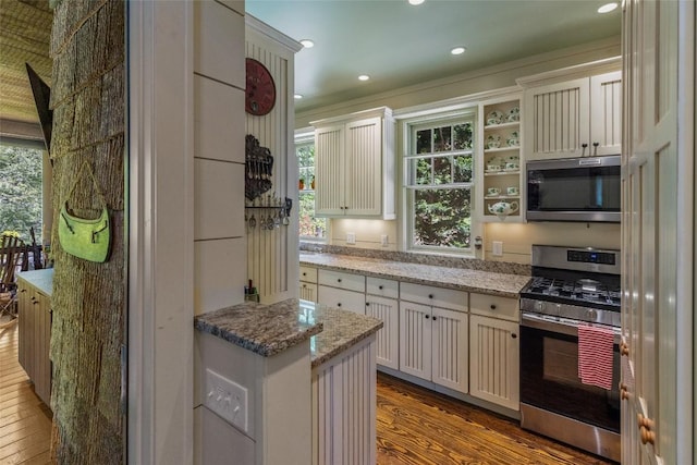 131 Big Creek Ln, Highlands, NC 28741 - kitchen featuring stainless steel appliances, wood finished floors, plenty of natural light, recessed lighting, and light stone counters