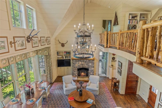 131 Big Creek Ln, Highlands, NC 28741 - living area with lofted ceiling, dark wood-style floors, a chandelier, and a fireplace