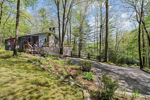 view of yard featuring a deck and fence