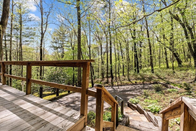 wooden deck featuring a wooded view