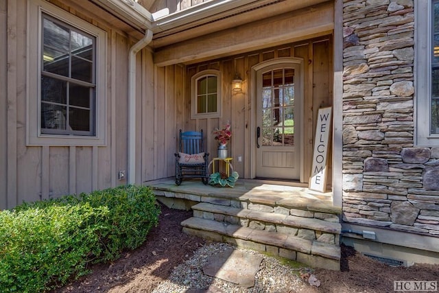 view of exterior entry with covered porch