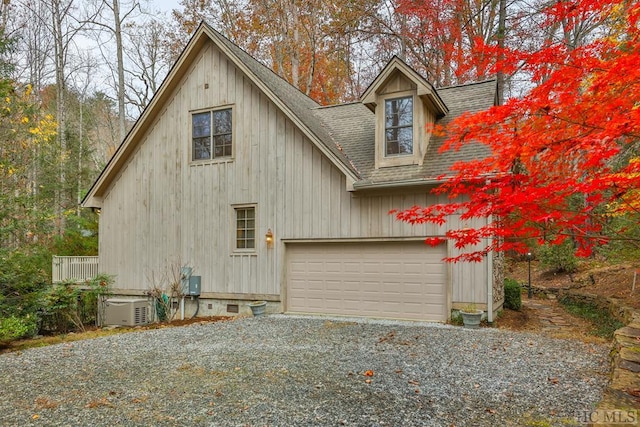 view of side of home featuring a garage