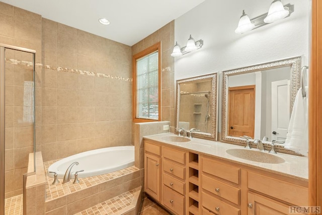 bathroom with plus walk in shower, vanity, and tile patterned floors