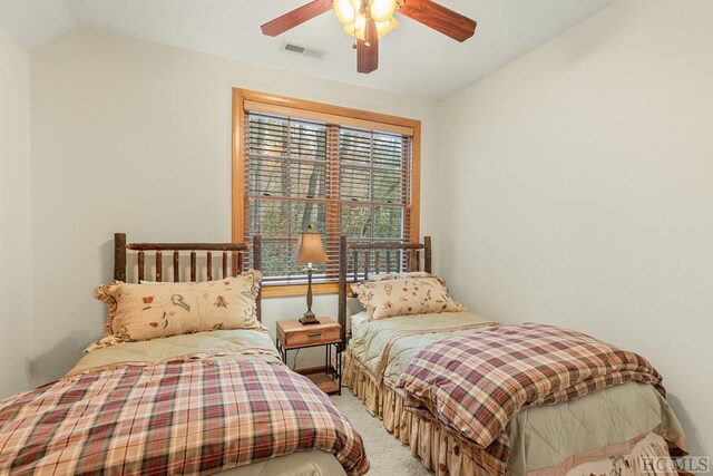 bedroom featuring ceiling fan, lofted ceiling, and carpet