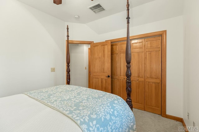 carpeted bedroom featuring vaulted ceiling