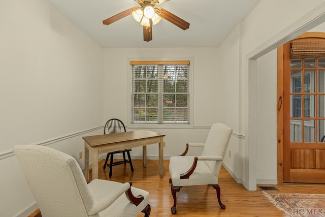 sitting room featuring light hardwood / wood-style flooring and ceiling fan