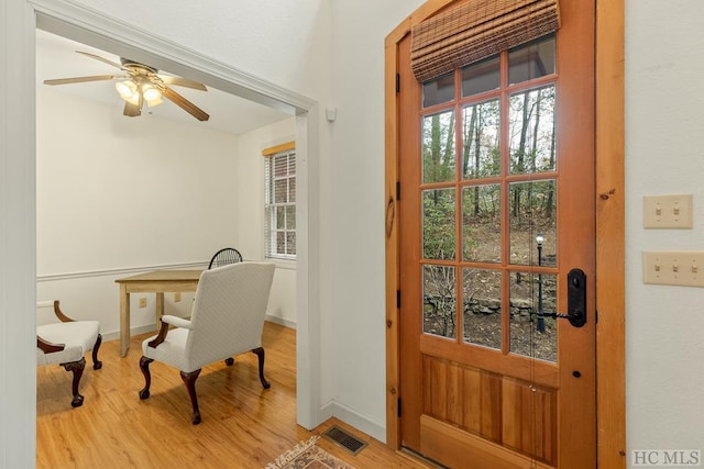 interior space with ceiling fan and light hardwood / wood-style floors