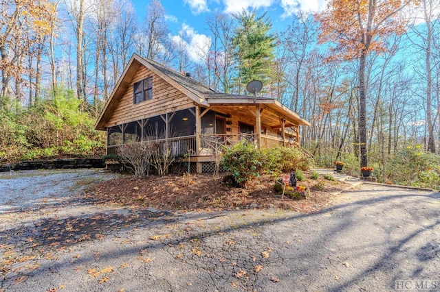 view of front of house with a sunroom