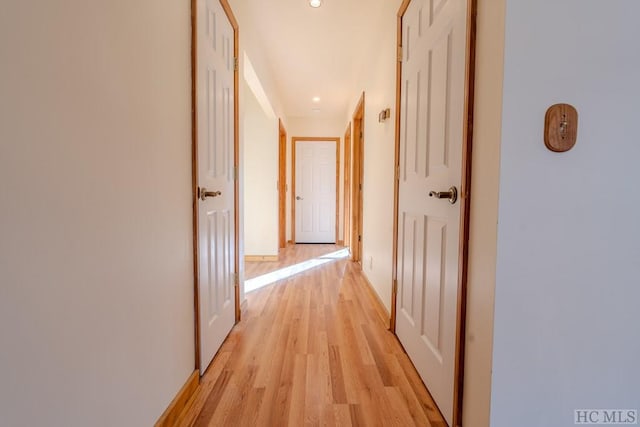 hall with light wood-type flooring