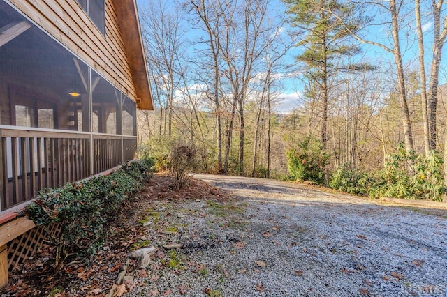 view of yard featuring a sunroom