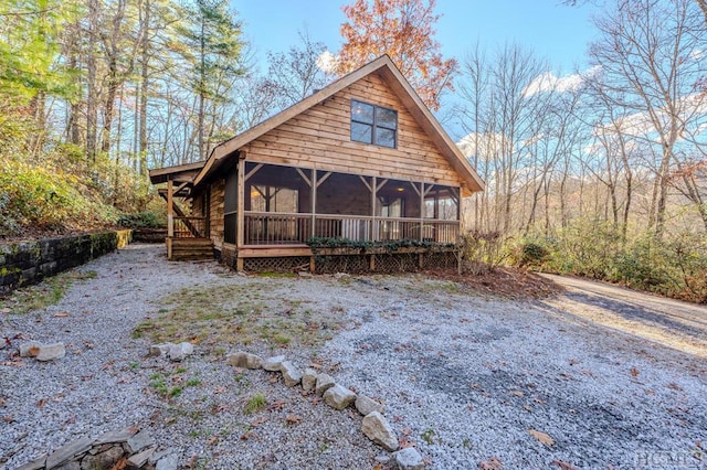 view of front of property featuring a sunroom