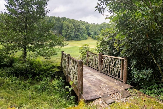 614 Fairway Dr, Lake Toxaway, NC 28747 - view of property's community featuring a yard and a view of trees