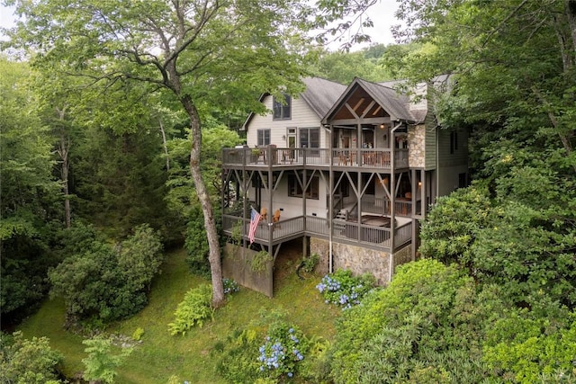 614 Fairway Dr, Lake Toxaway, NC 28747 - rear view of property featuring a wooden deck, stone siding, and a chimney