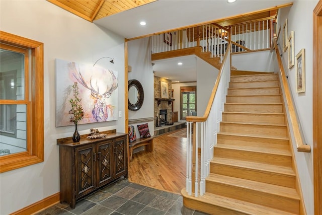 614 Fairway Dr, Lake Toxaway, NC 28747 - stairs featuring wooden ceiling, recessed lighting, a fireplace, and vaulted ceiling
