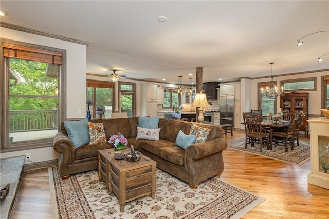614 Fairway Dr, Lake Toxaway, NC 28747 - living room with crown molding, light wood-style flooring, a chandelier, a ceiling fan, and recessed lighting