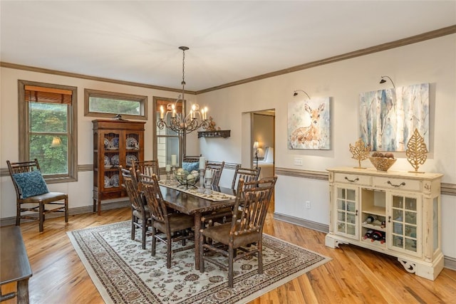 614 Fairway Dr, Lake Toxaway, NC 28747 - dining area featuring a chandelier, light wood-style floors, and ornamental molding