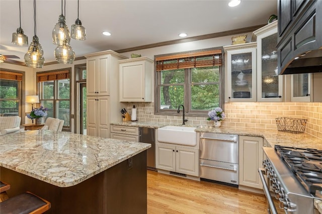614 Fairway Dr, Lake Toxaway, NC 28747 - kitchen featuring ornamental molding, ventilation hood, light stone counters, hanging light fixtures, and backsplash