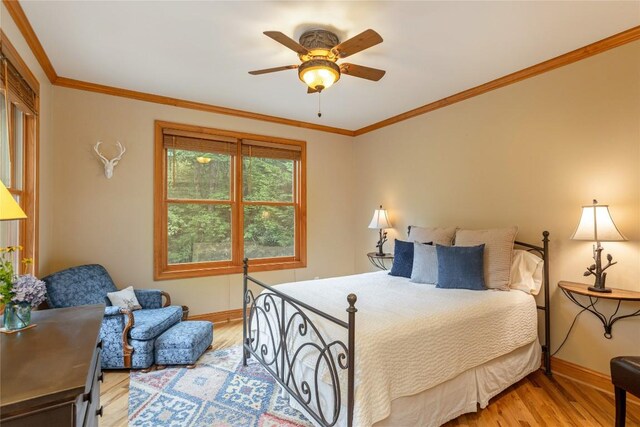 614 Fairway Dr, Lake Toxaway, NC 28747 - bedroom with light wood-style floors, crown molding, and ceiling fan